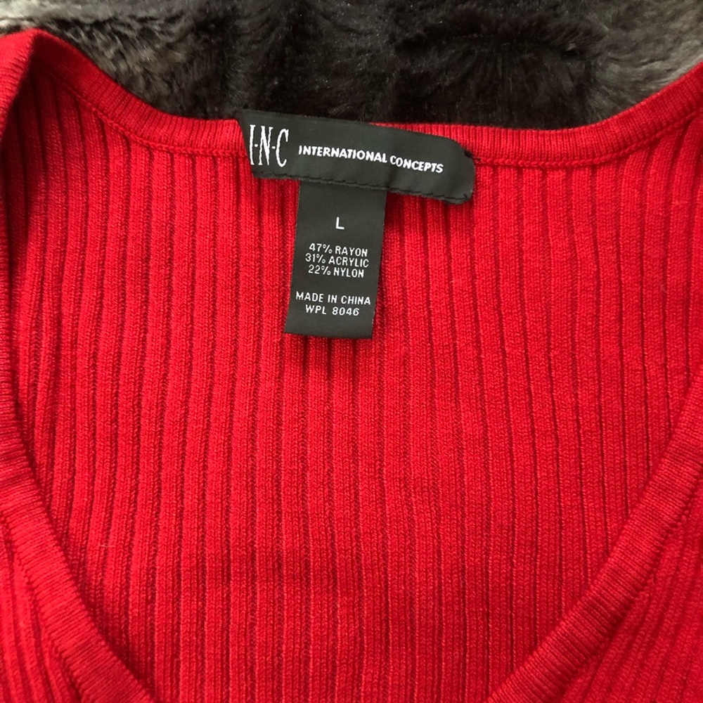 Red form fitting v neck sweater